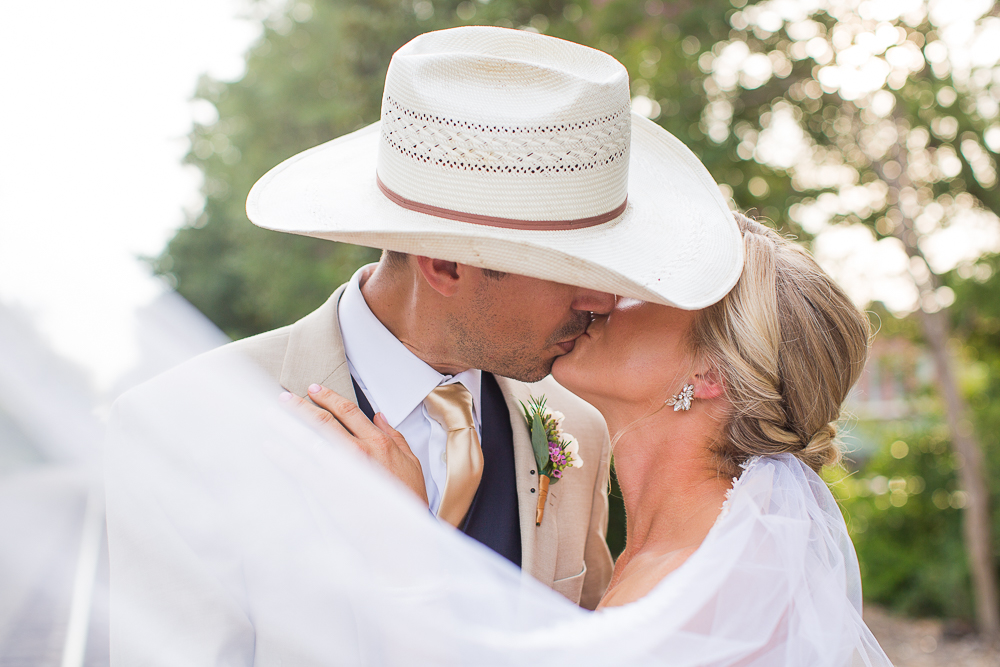 groom with cowboy hat