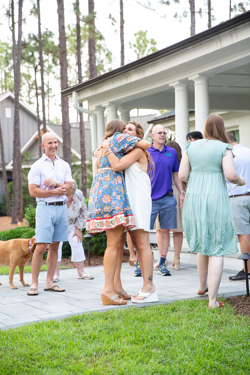 greeting guests at North Carolina wedding welcome party