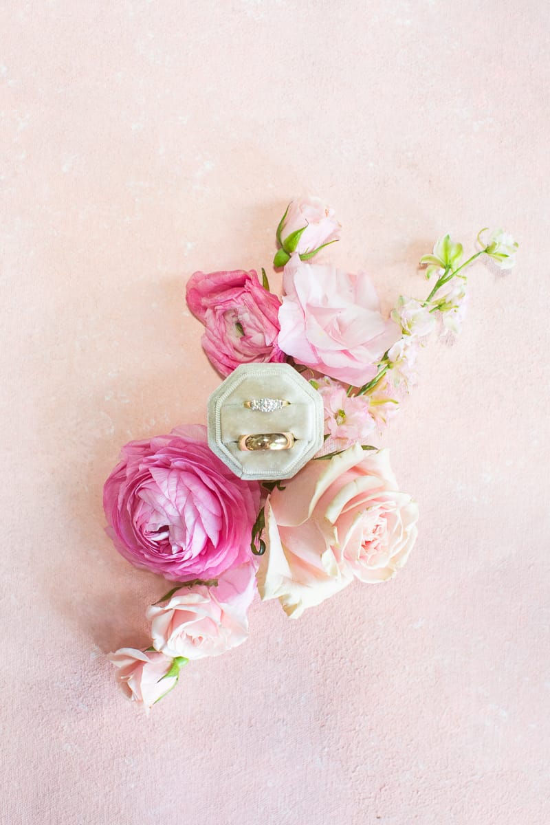 Wedding rings and floral details at a North Carolina wedding.