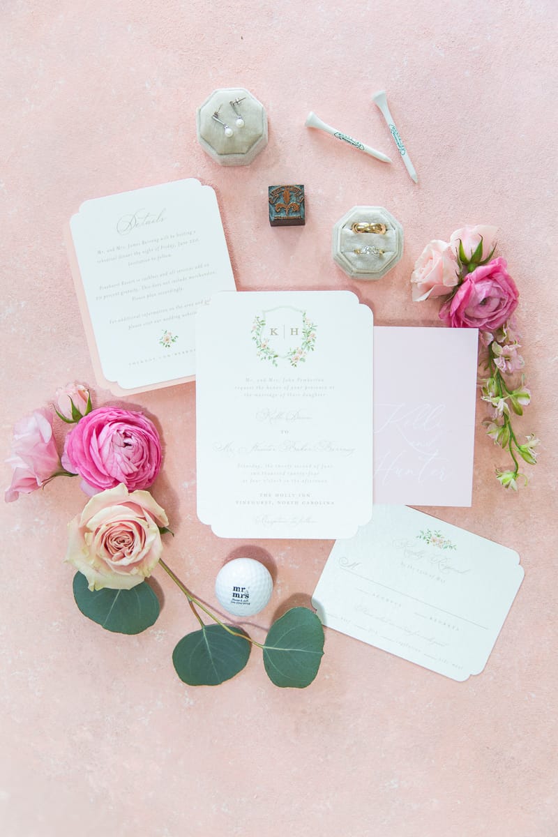 Wedding invitation suite with floral accents at a Pinehurst Resort wedding.