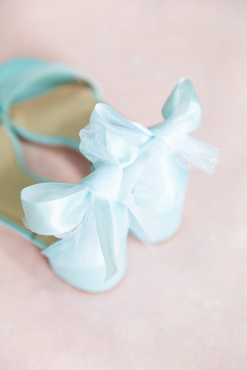 Elegant blue bow shoes for a bride at Pinehurst Resort wedding.