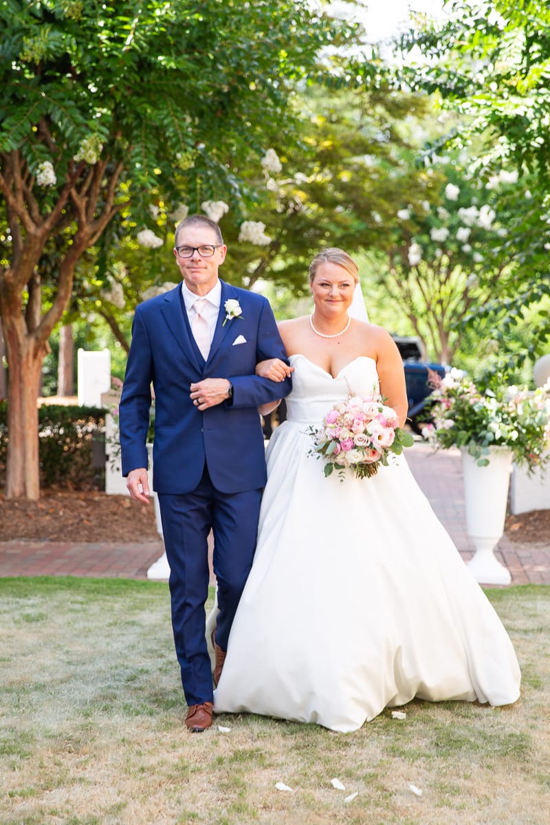 Pinehurst wedding at the Holly Inn bride walking down aisle with her dad