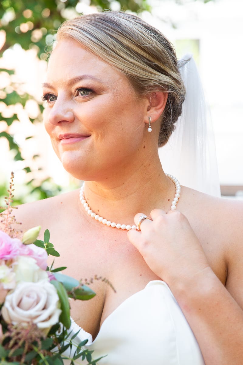 Close-up of bride with bouquet at Pinehurst wedding by Mollie Tobias Photography