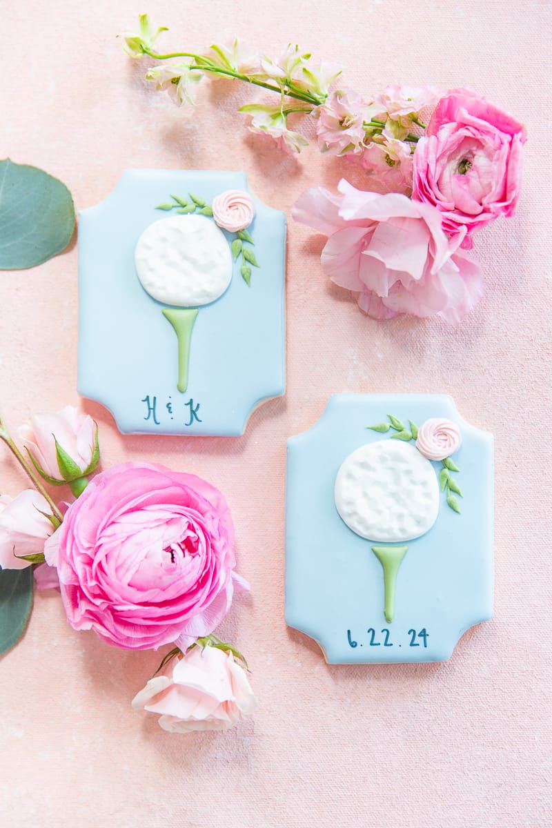 Wedding cookies
 with floral background at a Pinehurst wedding.