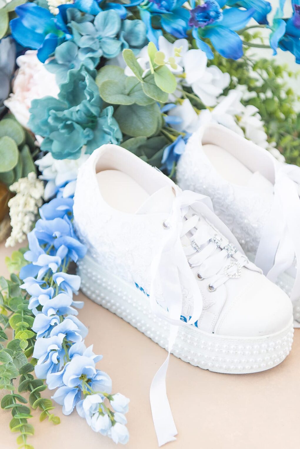 custom wedding shoes with lace, pearls, and embroidery