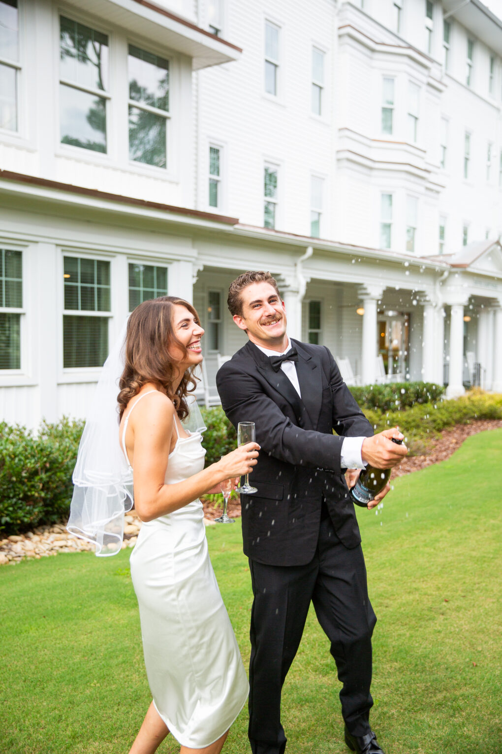 bride and groom on the East Lawn of the Carolina hotel at a Pinehurst wedding