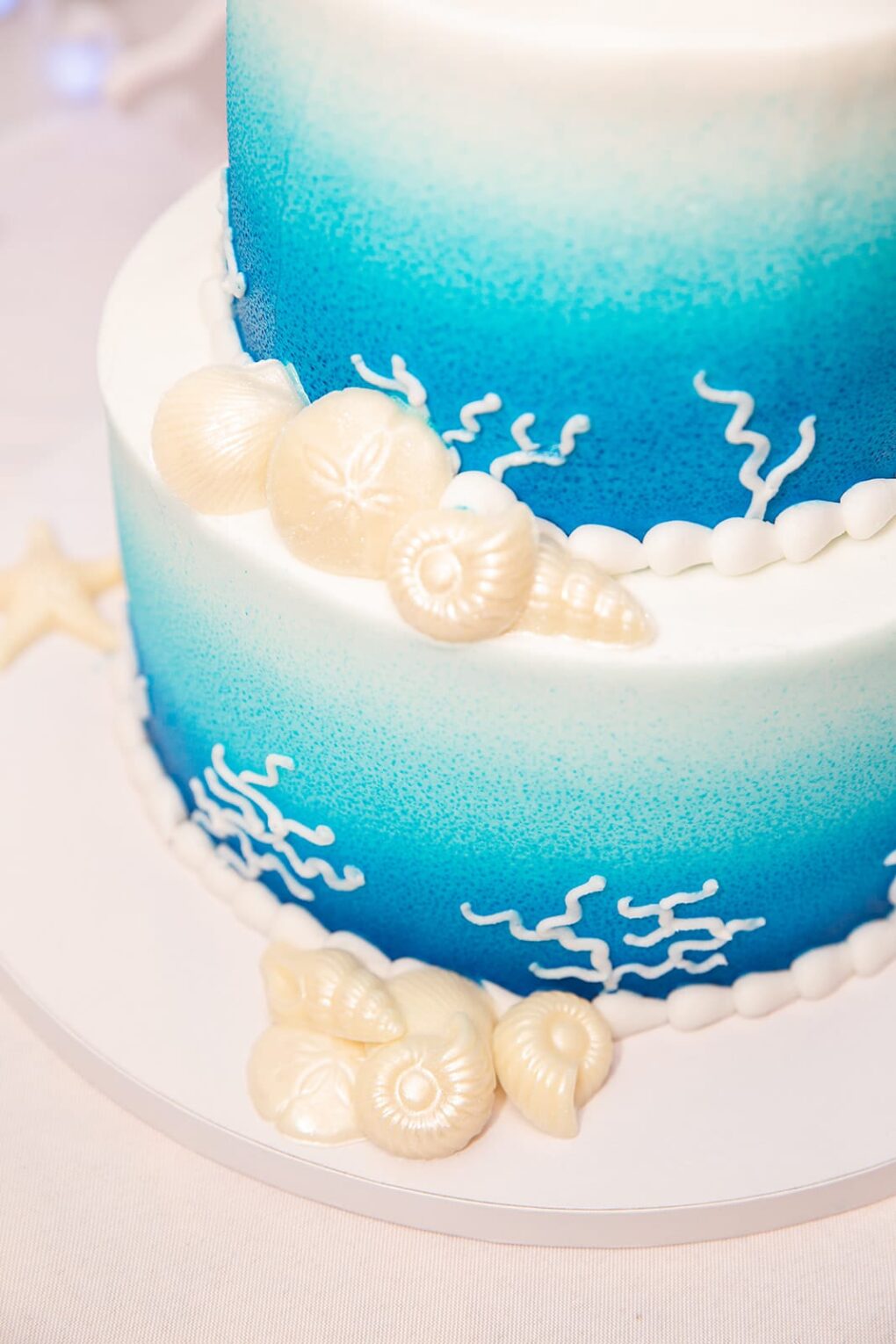 blue and white wedding cake for NC beach wedding at Shell Island Resort in Wrightsville Beach, nc