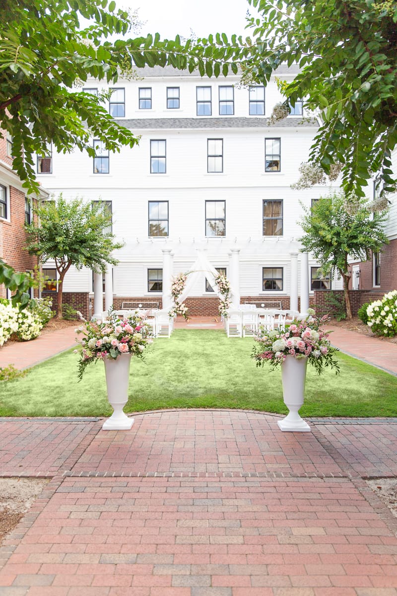 rear courtyard of the Holly Inn set up for a wedding ceremony