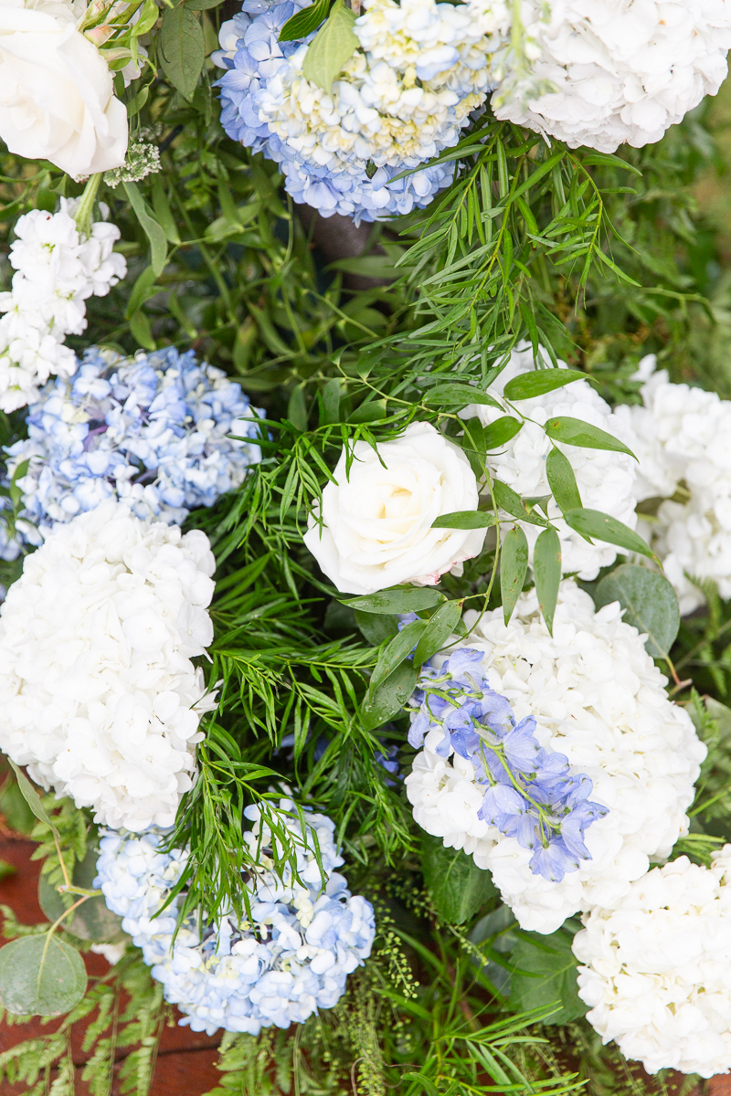 Close-up of blue and white floral arrangements used as wedding decor in Pinehurst, NC.
