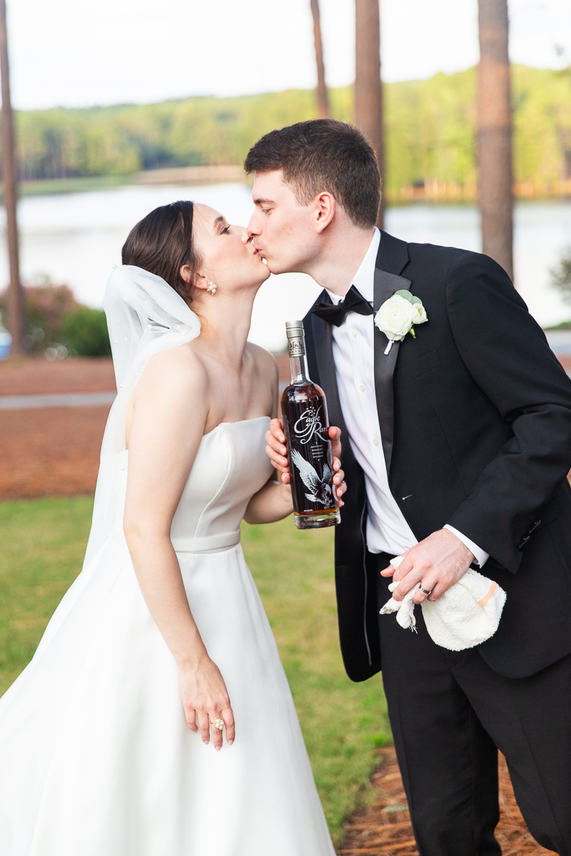 Bride and groom sharing a kiss during the reception at the Country Club of North Carolina.