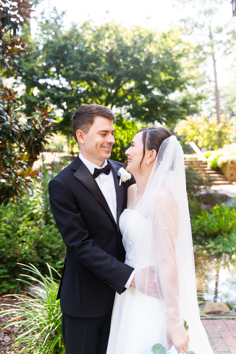 Classic wedding portrait of the bride and groom standing in the sunshine at CCNC in Pinehurst.