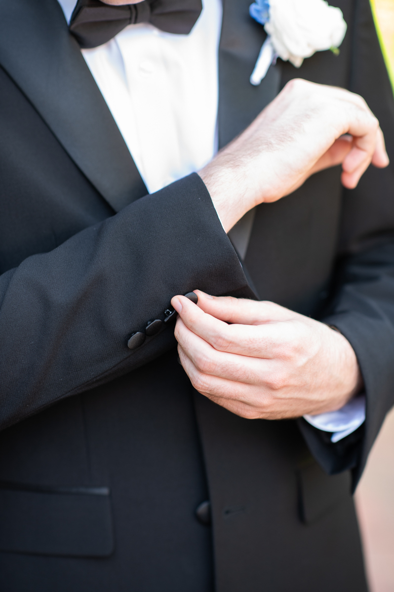 Groom preparing for the ceremony with a classic black tuxedo at a Pinehurst wedding.