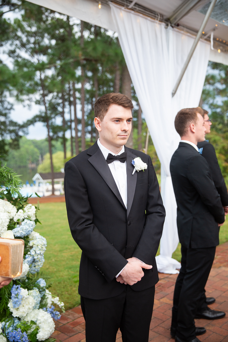 Groom waiting at the altar during the wedding ceremony at the Country Club in Pinehurst, NC.