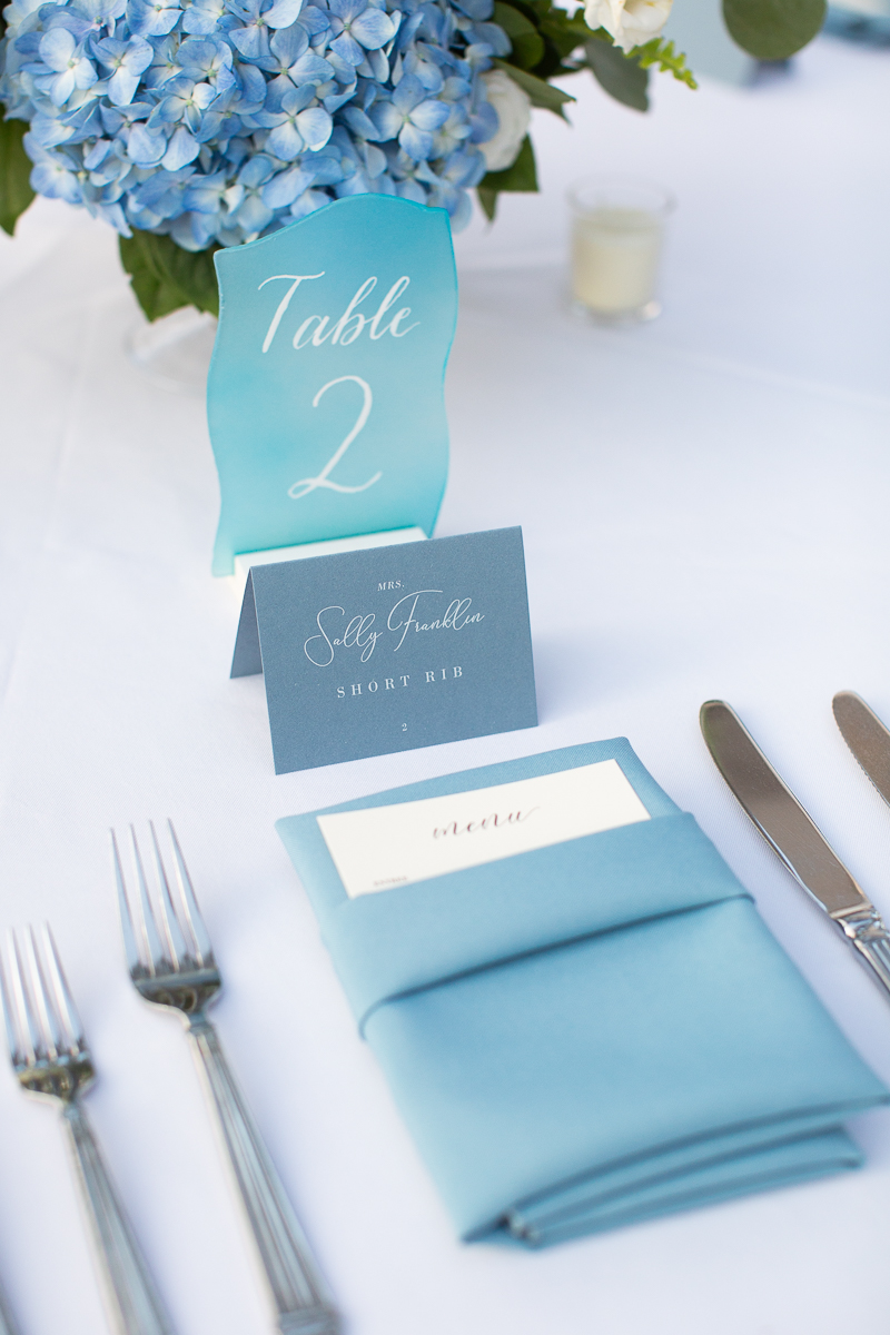 Wedding table setting with blue and white decor